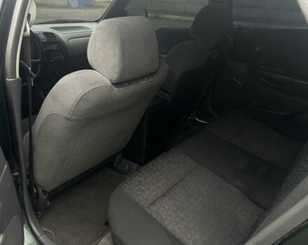 Зеленый Мазда 323, объемом двигателя 1.5 л и пробегом 400 тыс. км за 1500 $, фото 5 на Automoto.ua