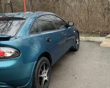 Зелений Мазда 323, об'ємом двигуна 1.5 л та пробігом 270 тис. км за 2000 $, фото 6 на Automoto.ua