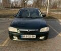 Зеленый Мазда 323, объемом двигателя 1.5 л и пробегом 260 тыс. км за 2600 $, фото 1 на Automoto.ua