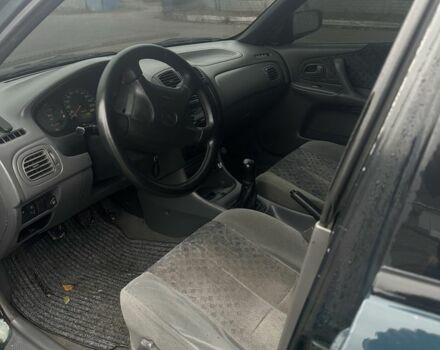 Зеленый Мазда 323, объемом двигателя 1.5 л и пробегом 400 тыс. км за 1500 $, фото 4 на Automoto.ua