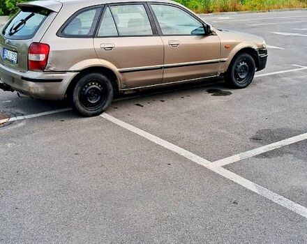 Зеленый Мазда 323, объемом двигателя 1.6 л и пробегом 299 тыс. км за 700 $, фото 1 на Automoto.ua