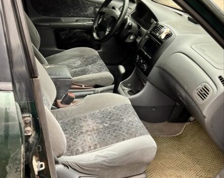 Мазда 323 1999 в Киеве на Automoto.ua Зеленый Мазда 323, объемом двигателя 1.5 л и пробегом 350 тыс. км за 2400 $, фото 7 на Automoto.ua