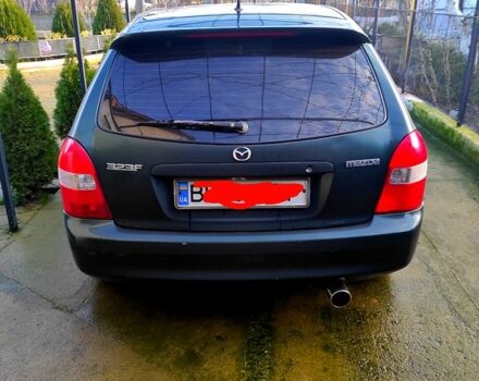 Зеленый Мазда 323, объемом двигателя 2 л и пробегом 210 тыс. км за 3000 $, фото 1 на Automoto.ua