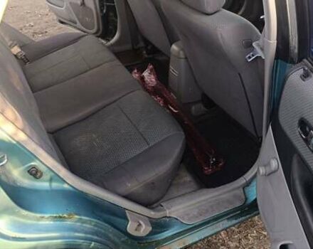 Зеленый Мазда 323, объемом двигателя 1.6 л и пробегом 288 тыс. км за 2000 $, фото 3 на Automoto.ua