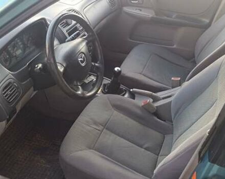 Зеленый Мазда 323, объемом двигателя 1.6 л и пробегом 288 тыс. км за 2000 $, фото 4 на Automoto.ua