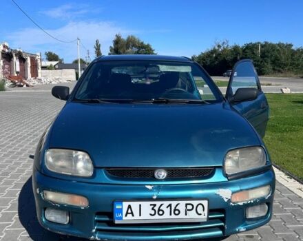 Зеленый Мазда 323, объемом двигателя 1.5 л и пробегом 317 тыс. км за 1300 $, фото 7 на Automoto.ua