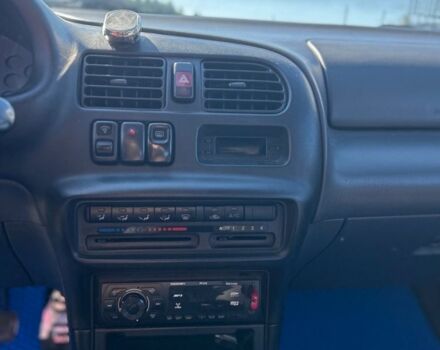 Зеленый Мазда 323, объемом двигателя 1.5 л и пробегом 317 тыс. км за 1300 $, фото 3 на Automoto.ua