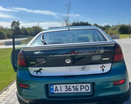 Зеленый Мазда 323, объемом двигателя 1.5 л и пробегом 317 тыс. км за 1300 $, фото 11 на Automoto.ua