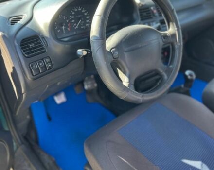 Зеленый Мазда 323, объемом двигателя 1.5 л и пробегом 317 тыс. км за 1300 $, фото 9 на Automoto.ua