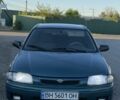 Зеленый Мазда 323, объемом двигателя 1.3 л и пробегом 250 тыс. км за 1800 $, фото 1 на Automoto.ua