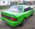 Зеленый Мазда 323, объемом двигателя 1.6 л и пробегом 444 тыс. км за 1700 $, фото 1 на Automoto.ua