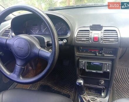 Зелений Мазда 323, об'ємом двигуна 1.6 л та пробігом 450 тис. км за 1300 $, фото 9 на Automoto.ua