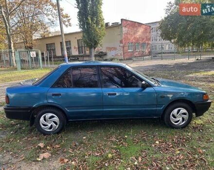 Зеленый Мазда 323, объемом двигателя 1.6 л и пробегом 200 тыс. км за 1000 $, фото 5 на Automoto.ua