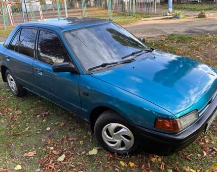 Зелений Мазда 323, об'ємом двигуна 1.3 л та пробігом 200 тис. км за 1250 $, фото 1 на Automoto.ua