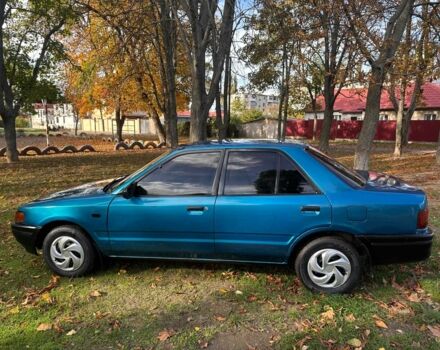 Зелений Мазда 323, об'ємом двигуна 1.3 л та пробігом 200 тис. км за 1250 $, фото 7 на Automoto.ua