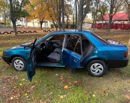 Зелений Мазда 323, об'ємом двигуна 1.3 л та пробігом 200 тис. км за 1250 $, фото 2 на Automoto.ua