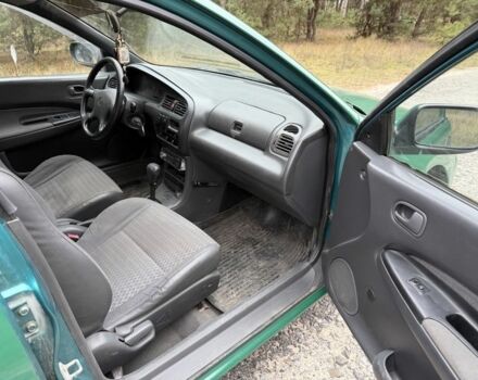 Зеленый Мазда 323, объемом двигателя 1.5 л и пробегом 213 тыс. км за 2950 $, фото 9 на Automoto.ua