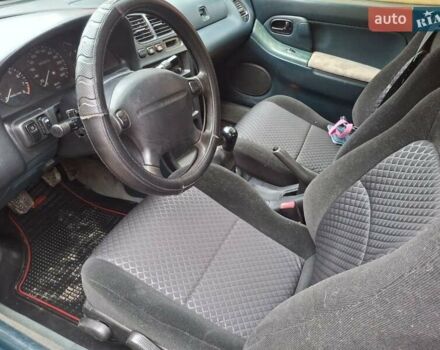 Зеленый Мазда 323, объемом двигателя 1.8 л и пробегом 460 тыс. км за 2900 $, фото 6 на Automoto.ua