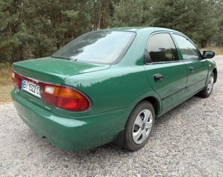 Зеленый Мазда 323, объемом двигателя 1.5 л и пробегом 213 тыс. км за 2950 $, фото 2 на Automoto.ua