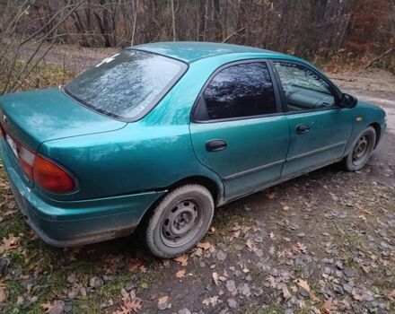 Зеленый Мазда 323, объемом двигателя 1.5 л и пробегом 308 тыс. км за 1548 $, фото 3 на Automoto.ua