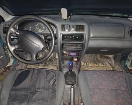 Зеленый Мазда 323, объемом двигателя 1.5 л и пробегом 308 тыс. км за 1548 $, фото 7 на Automoto.ua