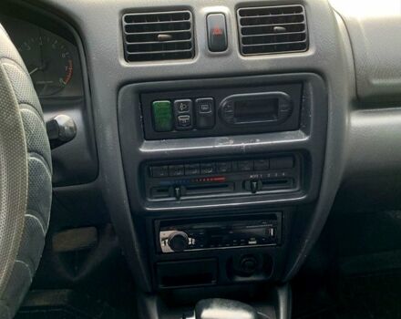 Зеленый Мазда 323, объемом двигателя 1.5 л и пробегом 254 тыс. км за 1800 $, фото 4 на Automoto.ua