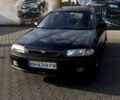 Зеленый Мазда 323, объемом двигателя 1.5 л и пробегом 353 тыс. км за 1200 $, фото 1 на Automoto.ua