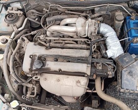 Зелений Мазда 323, об'ємом двигуна 1.5 л та пробігом 100 тис. км за 525 $, фото 4 на Automoto.ua