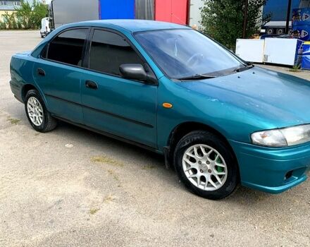 Зеленый Мазда 323, объемом двигателя 1.5 л и пробегом 254 тыс. км за 1800 $, фото 6 на Automoto.ua