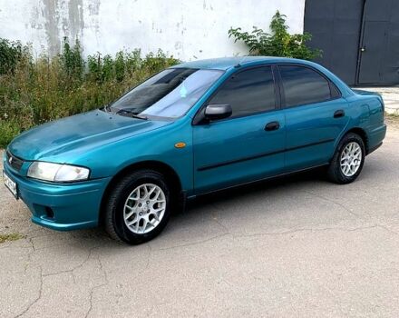Зеленый Мазда 323, объемом двигателя 1.5 л и пробегом 254 тыс. км за 1800 $, фото 8 на Automoto.ua