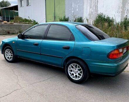 Зеленый Мазда 323, объемом двигателя 1.5 л и пробегом 254 тыс. км за 1800 $, фото 10 на Automoto.ua