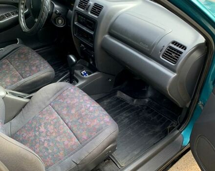 Зеленый Мазда 323, объемом двигателя 1.5 л и пробегом 254 тыс. км за 1800 $, фото 13 на Automoto.ua