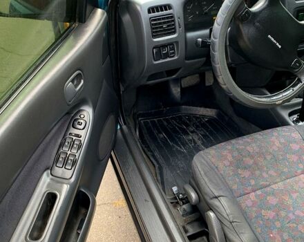 Зеленый Мазда 323, объемом двигателя 1.5 л и пробегом 254 тыс. км за 1800 $, фото 3 на Automoto.ua