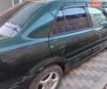 Зеленый Мазда 323, объемом двигателя 1.5 л и пробегом 367 тыс. км за 1700 $, фото 1 на Automoto.ua