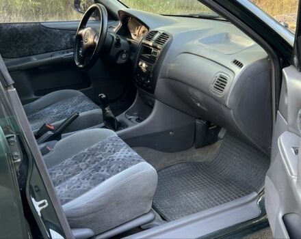 Зелений Мазда 323, об'ємом двигуна 1.8 л та пробігом 4 тис. км за 1900 $, фото 5 на Automoto.ua