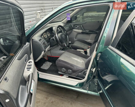 Зеленый Мазда 323, объемом двигателя 1.6 л и пробегом 230 тыс. км за 3000 $, фото 11 на Automoto.ua