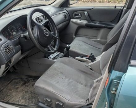 Зеленый Мазда 323, объемом двигателя 1.6 л и пробегом 289 тыс. км за 1999 $, фото 6 на Automoto.ua