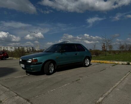 Зеленый Мазда 323, объемом двигателя 1.3 л и пробегом 380 тыс. км за 1100 $, фото 1 на Automoto.ua