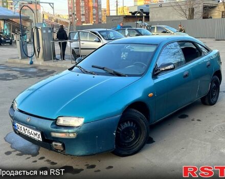 Зеленый Мазда 323, объемом двигателя 1.5 л и пробегом 215 тыс. км за 900 $, фото 1 на Automoto.ua
