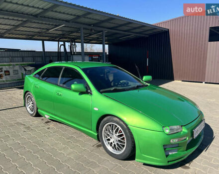 Зеленый Мазда 323, объемом двигателя 2 л и пробегом 200 тыс. км за 4200 $, фото 1 на Automoto.ua
