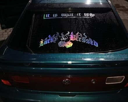 Зеленый Мазда 323, объемом двигателя 1.5 л и пробегом 350 тыс. км за 2750 $, фото 1 на Automoto.ua