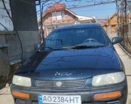 Зелений Мазда 323, об'ємом двигуна 1.8 л та пробігом 500 тис. км за 1850 $, фото 1 на Automoto.ua