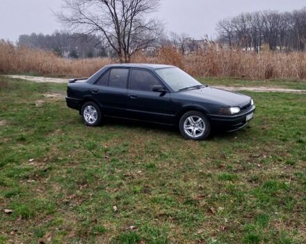 Зеленый Мазда 323, объемом двигателя 1.6 л и пробегом 333 тыс. км за 950 $, фото 1 на Automoto.ua