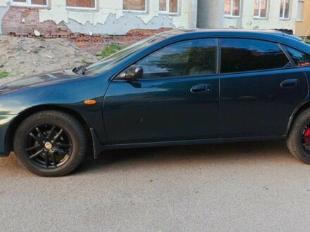 Зеленый Мазда 323, объемом двигателя 1.5 л и пробегом 348 тыс. км за 1654 $, фото 1 на Automoto.ua