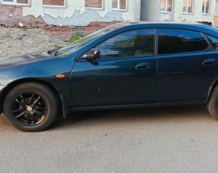 Зелений Мазда 323, об'ємом двигуна 1.5 л та пробігом 348 тис. км за 1654 $, фото 1 на Automoto.ua