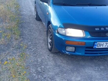 Зеленый Мазда 323, объемом двигателя 1.5 л и пробегом 300 тыс. км за 1903 $, фото 1 на Automoto.ua