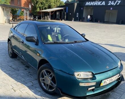 Зелений Мазда 323, об'ємом двигуна 1.5 л та пробігом 300 тис. км за 2000 $, фото 1 на Automoto.ua