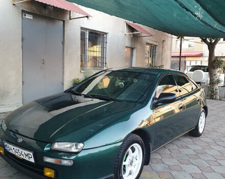 Зелений Мазда 323, об'ємом двигуна 1.5 л та пробігом 340 тис. км за 3000 $, фото 1 на Automoto.ua