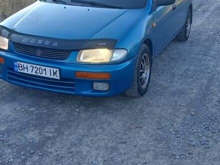 Зеленый Мазда 323, объемом двигателя 1.5 л и пробегом 300 тыс. км за 1903 $, фото 1 на Automoto.ua