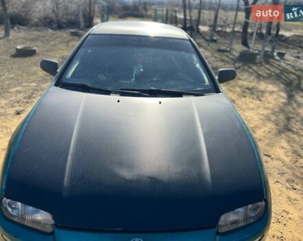 Зеленый Мазда 323, объемом двигателя 1.5 л и пробегом 326 тыс. км за 2700 $, фото 1 на Automoto.ua